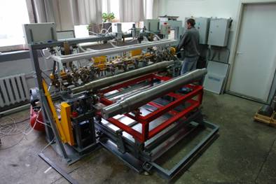 SNK OS-3 automated non-destructive rail axles testing system during their production SNK OS-3 automated non-destructive rail axles testing system during their production