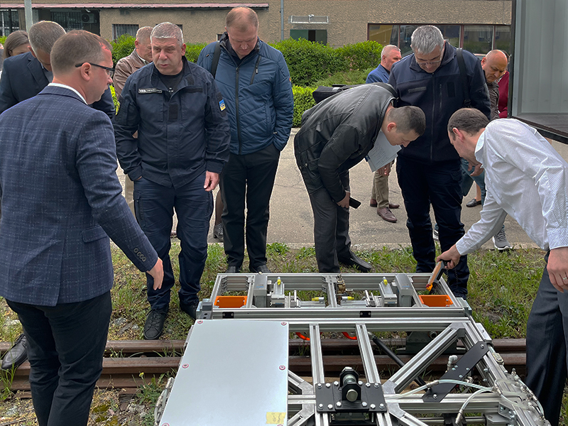Participants of the OKOndt GROUP ’s exhibition inspect the OKOSCAN 73HS System, 2025, Kyiv