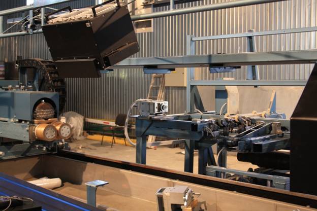 Оборудование УФ освещения поверхности оси с механизацией перемещения лампы магнитопорошковой установки УМПК-Ось-38